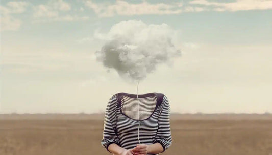An illustration representing brain fog shows a woman's body with a cloud of fog covering her head."