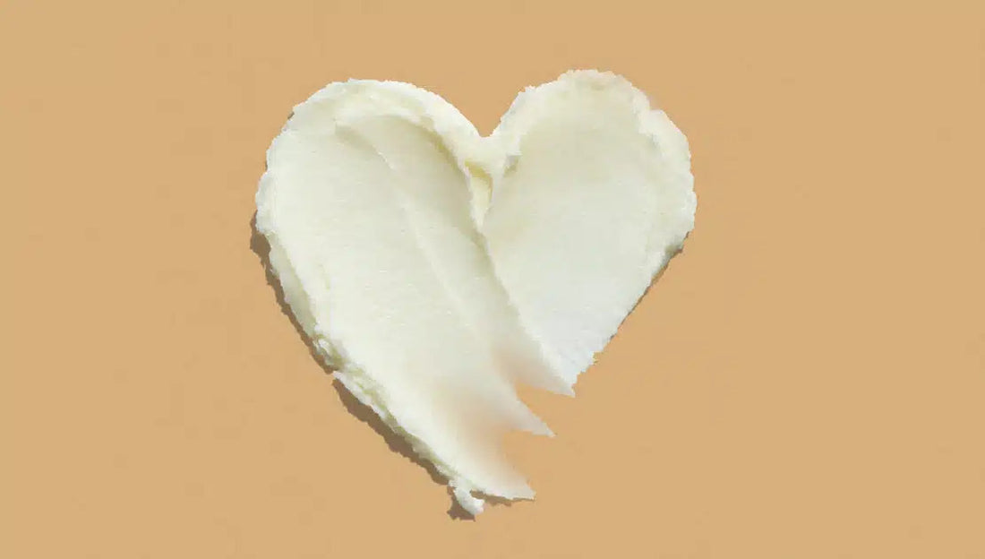 Heart shape shea butter cream texture smudge stroke on beige