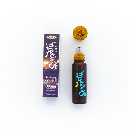 Serenity CBD Sunrise Blend Roller shown open next to its box—highlighting convenient, on-the-go application for refreshing balance and relief