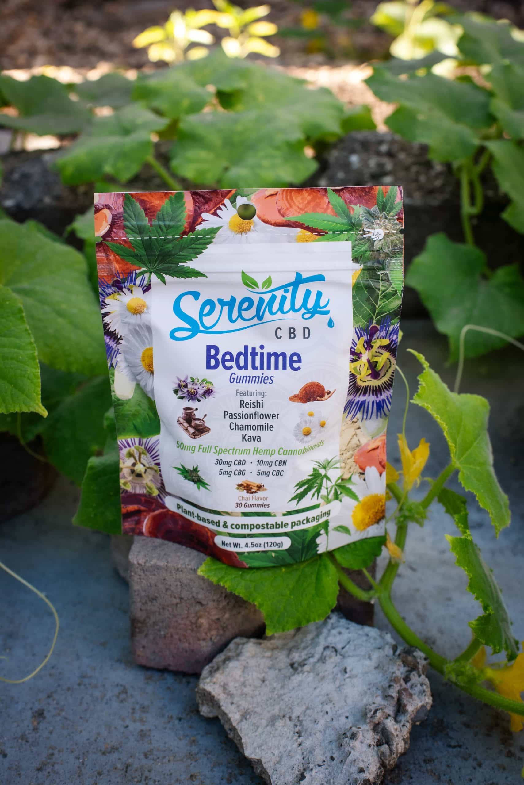 Serenity CBD ‘Bedtime’ gummies pouch photographed in a natural garden setting—highlighting the product’s connection to plant-powered relaxation and restorative wellness