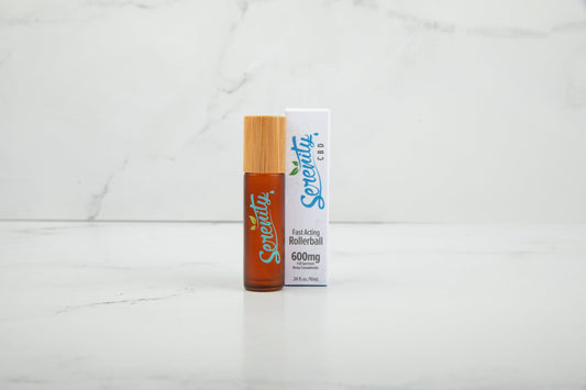 Serenity CBD Classic Blend Roller with packaging on a marble surface—crafted for easy, fast-acting topical relief and everyday balance