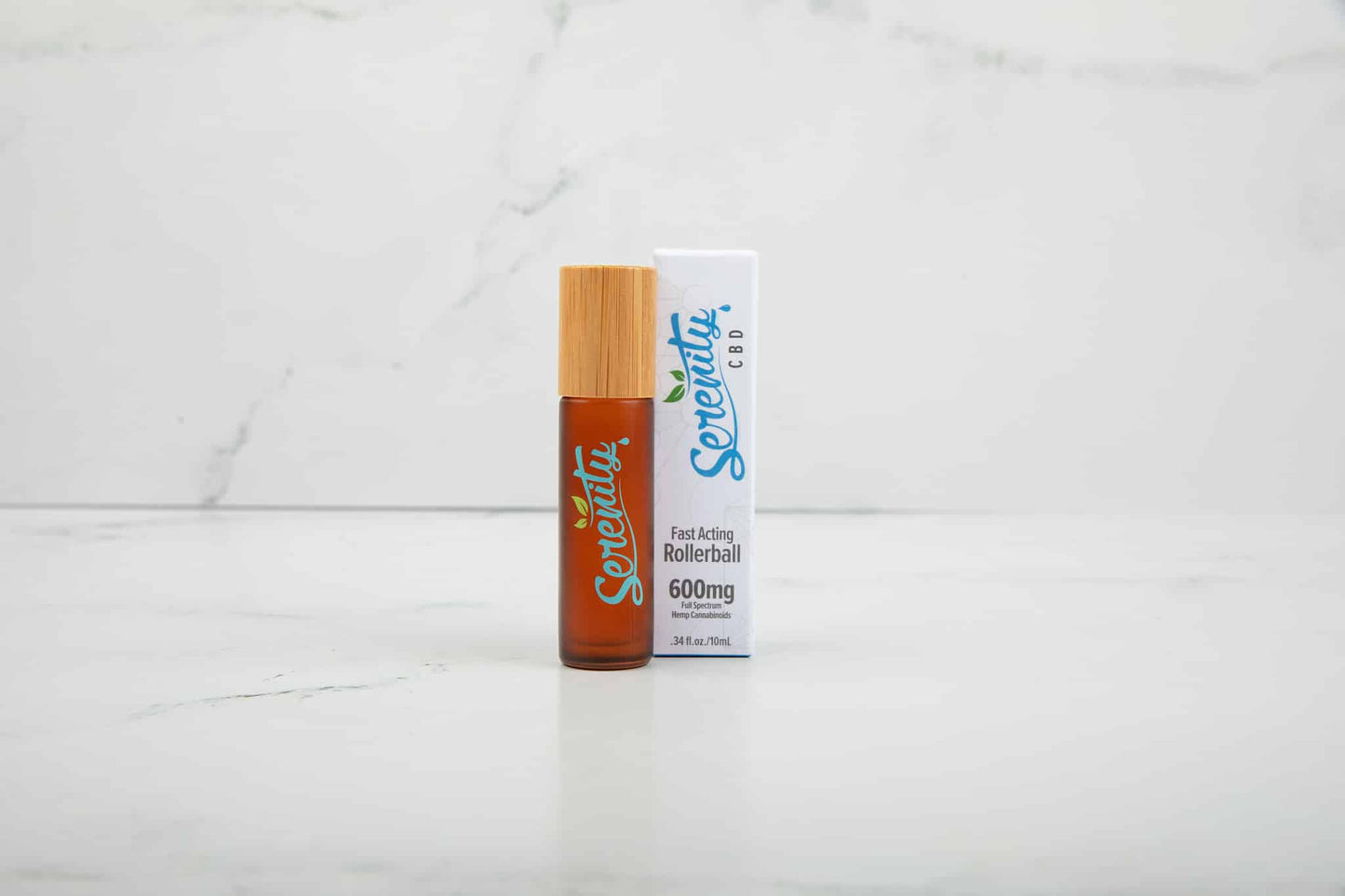 Serenity CBD Sunrise fast-acting rollerball on a white marble background—designed for convenient, on-the-go wellness and energizing relief