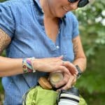 woman applying CBD balm